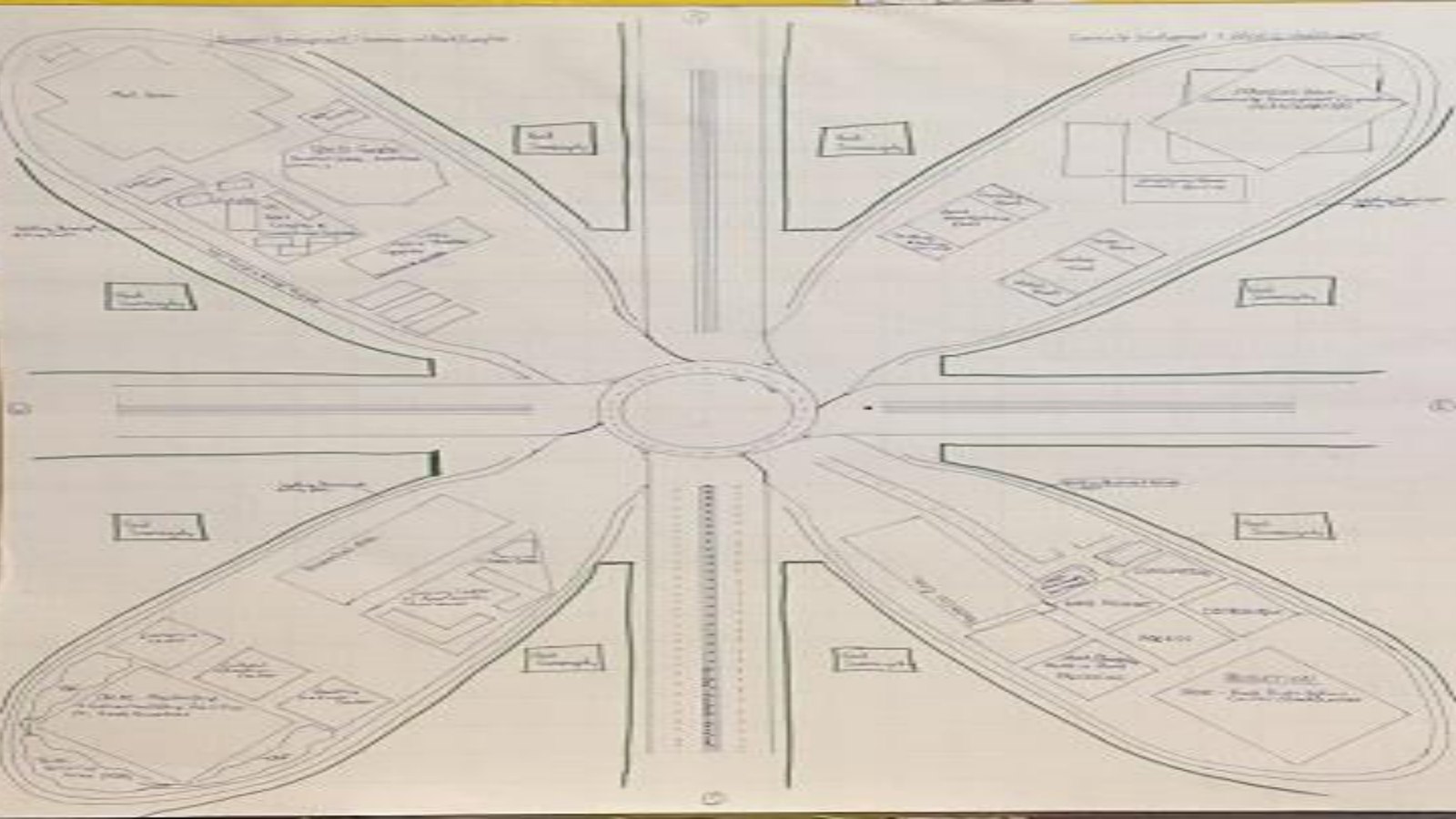 The original 2017 hand-drawn community master plan — four feather-shaped development sections around a central roundabout.